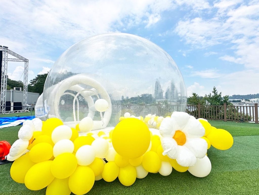 bouncy balloon dome with yellow balloon garland decor