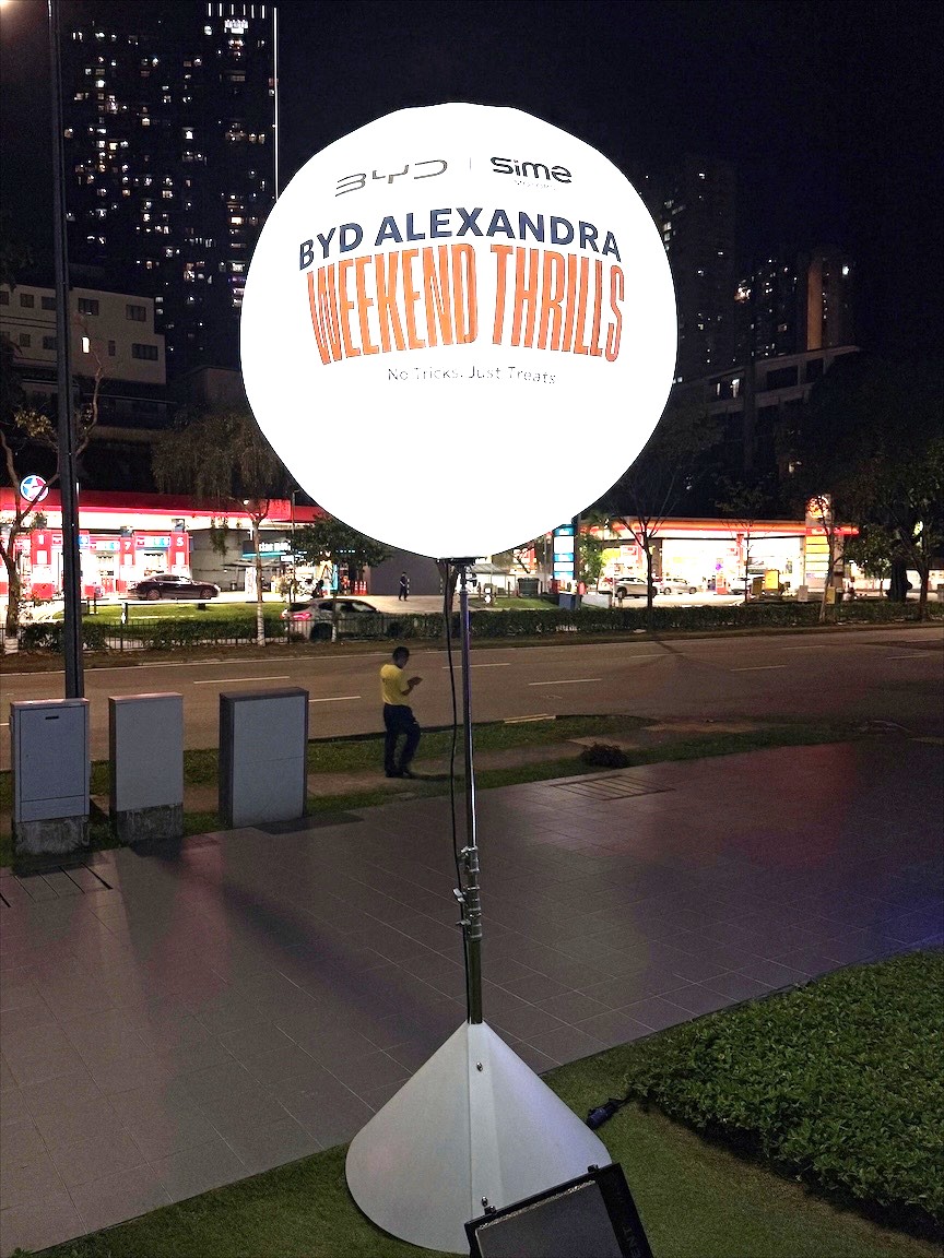 Pair of Lighted Balloon Stand Singapore units flanking exhibition booth