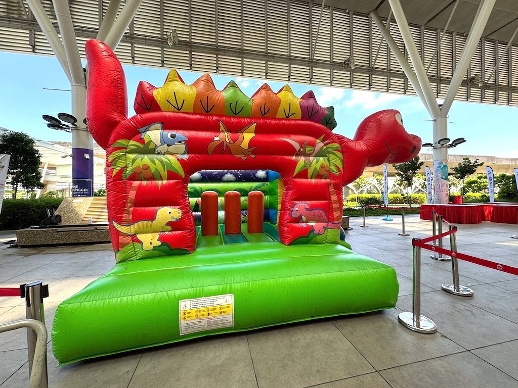 Dinosaur themed bouncy castle rental for outdoor kids event in Singapore