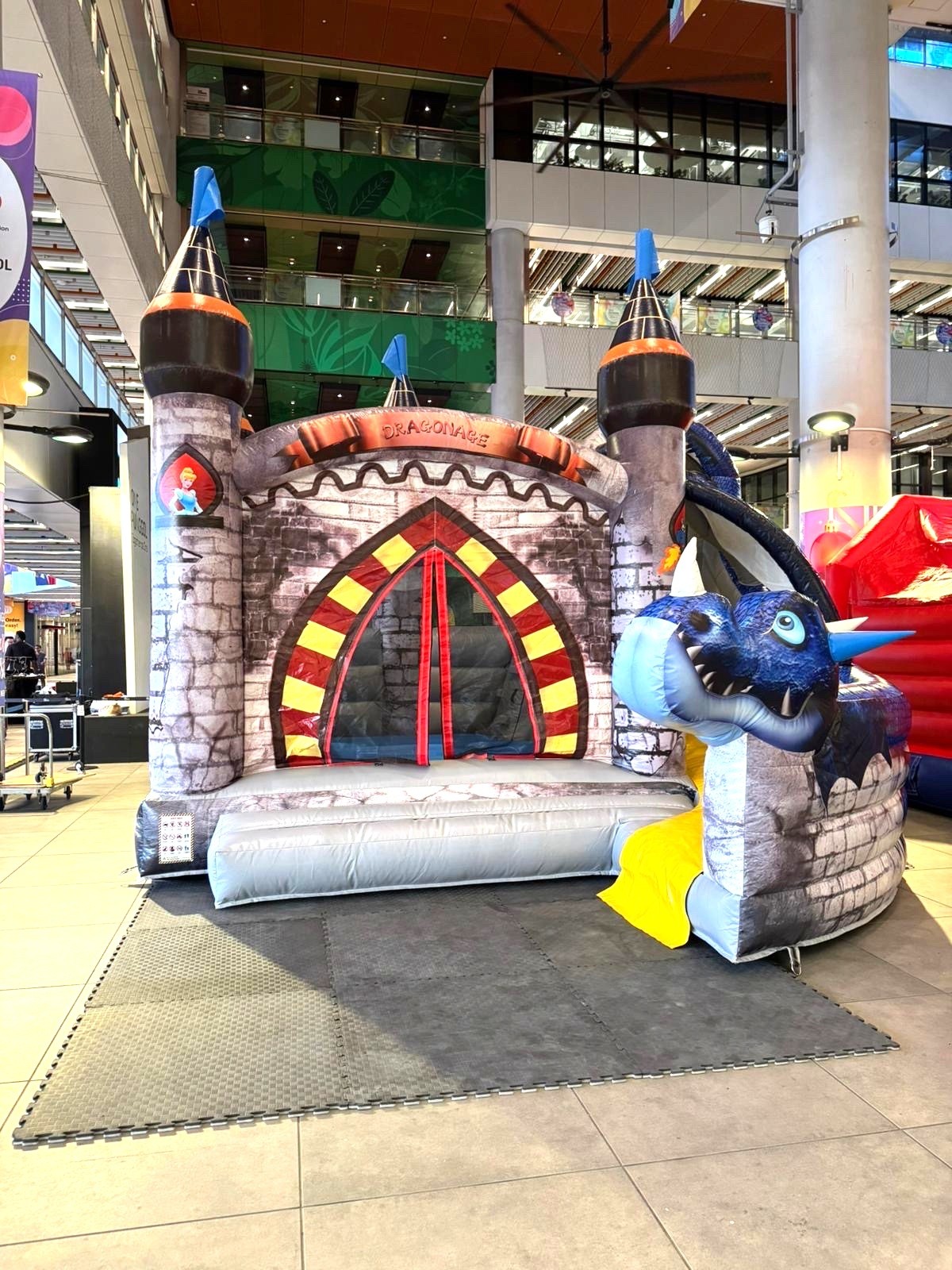 Dragon-themed bouncy castle rental at indoor mall event Singapore