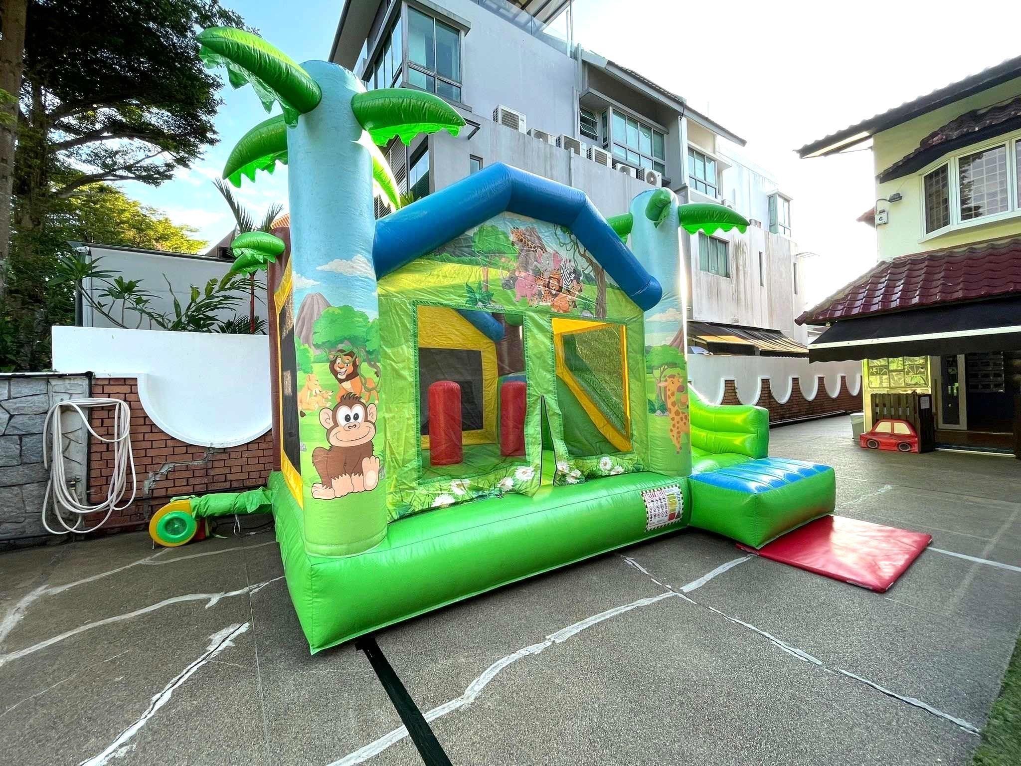 Jungle theme bouncy castle rental for kids party in Singapore