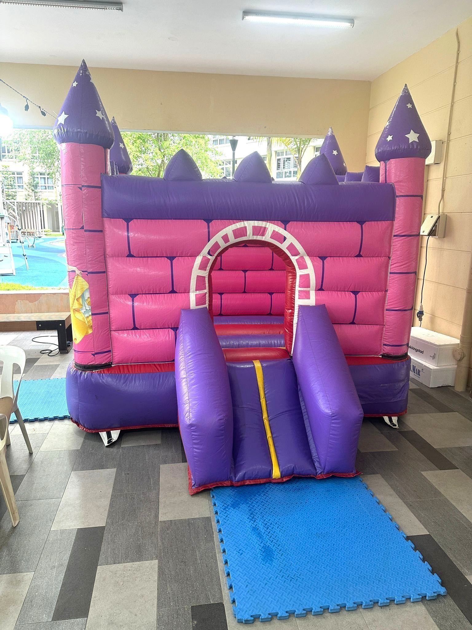 Pink and purple princess bouncy castle rental for kids birthday party Singapore