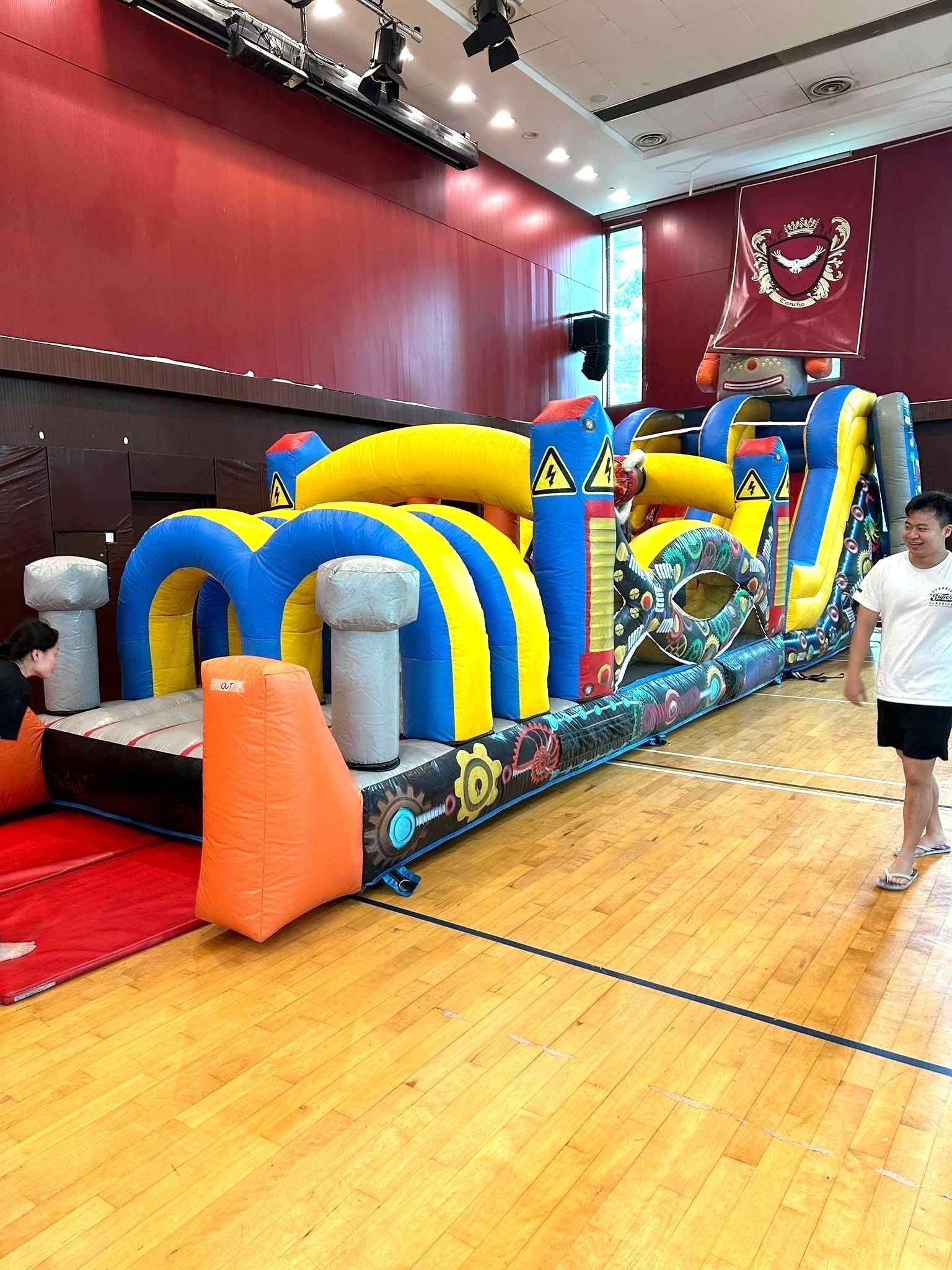 Robot-themed inflatable obstacle course rental at school hall Singapore