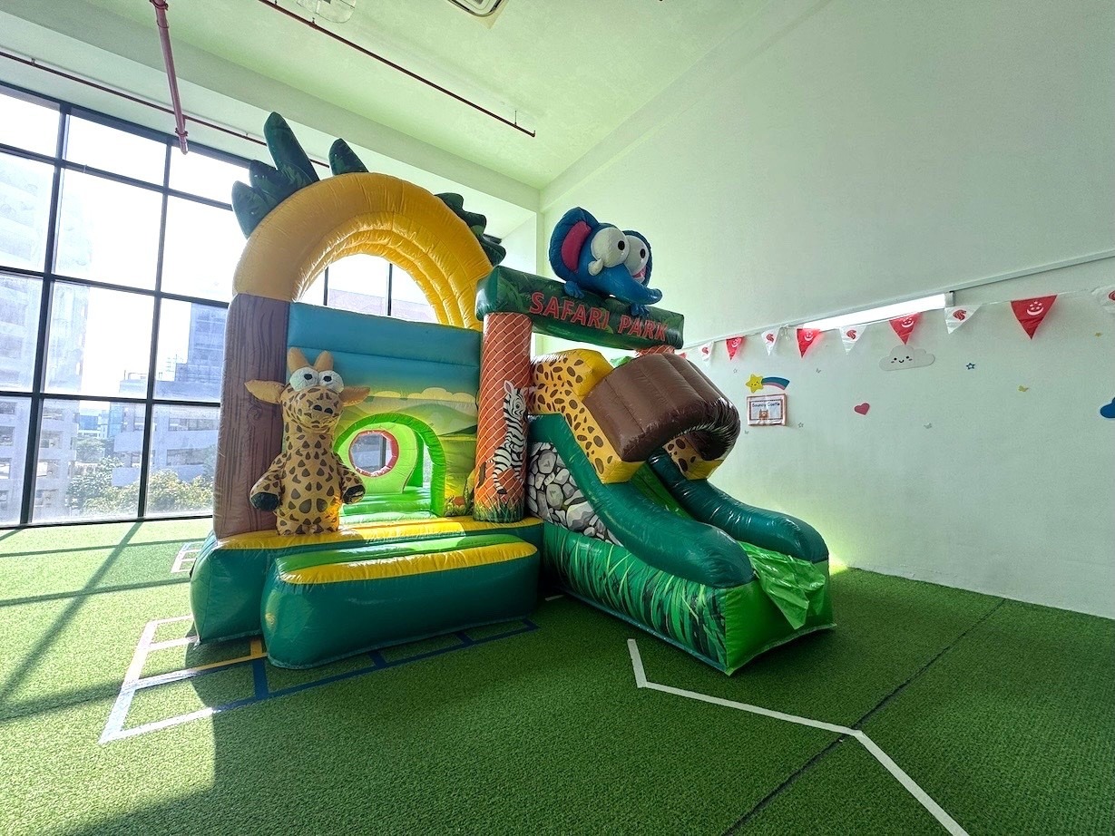 Safari park themed bouncy castle with slide for kids party rental in Singapore