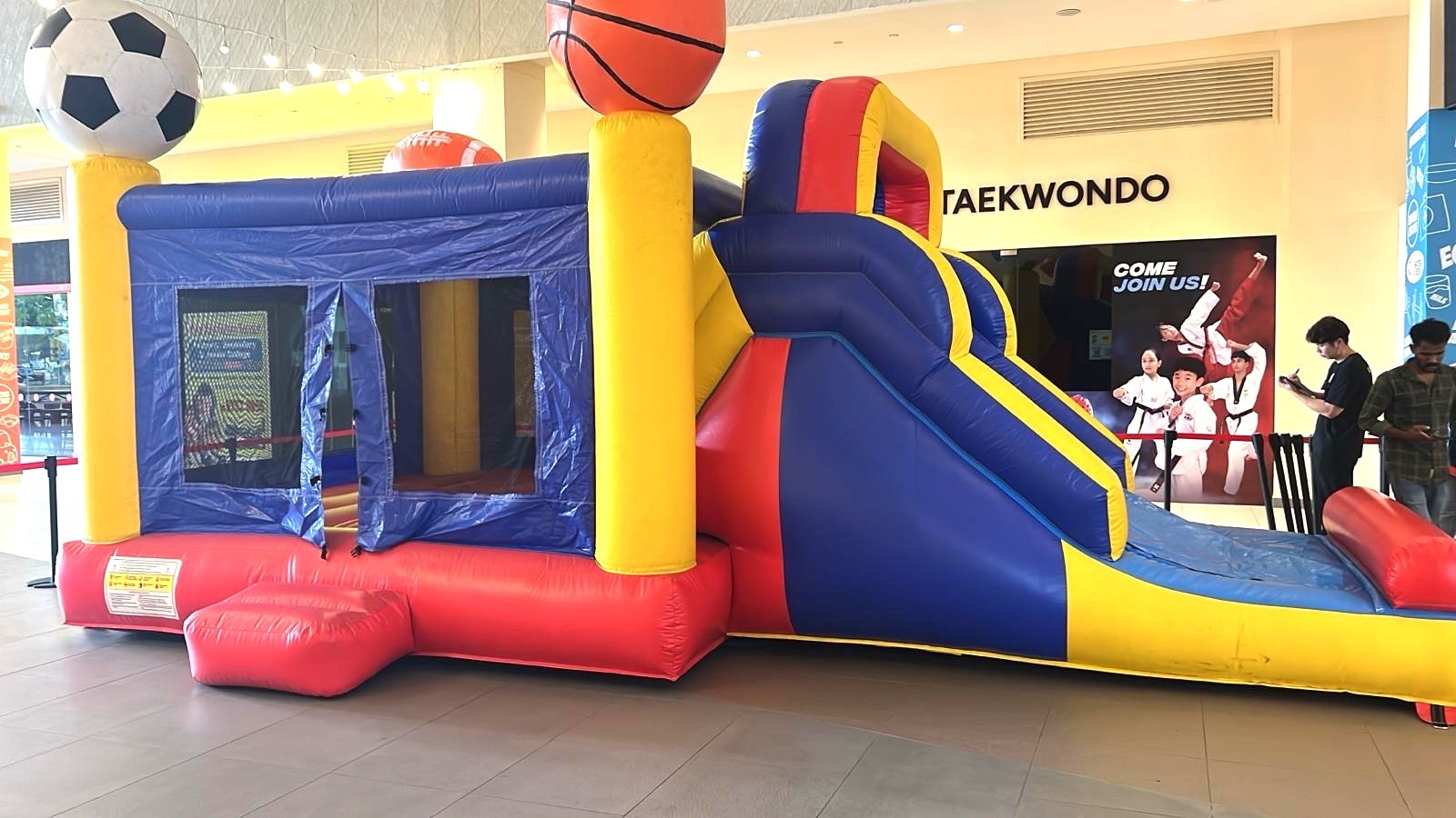 Sports themed bouncy castle with slide for mall event rental in Singapore