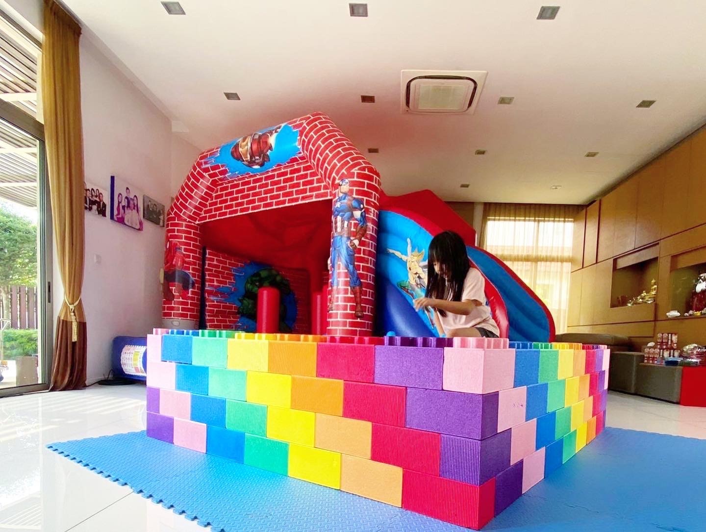 Superhero themed bouncy castle for indoor kids party rental in Singapore