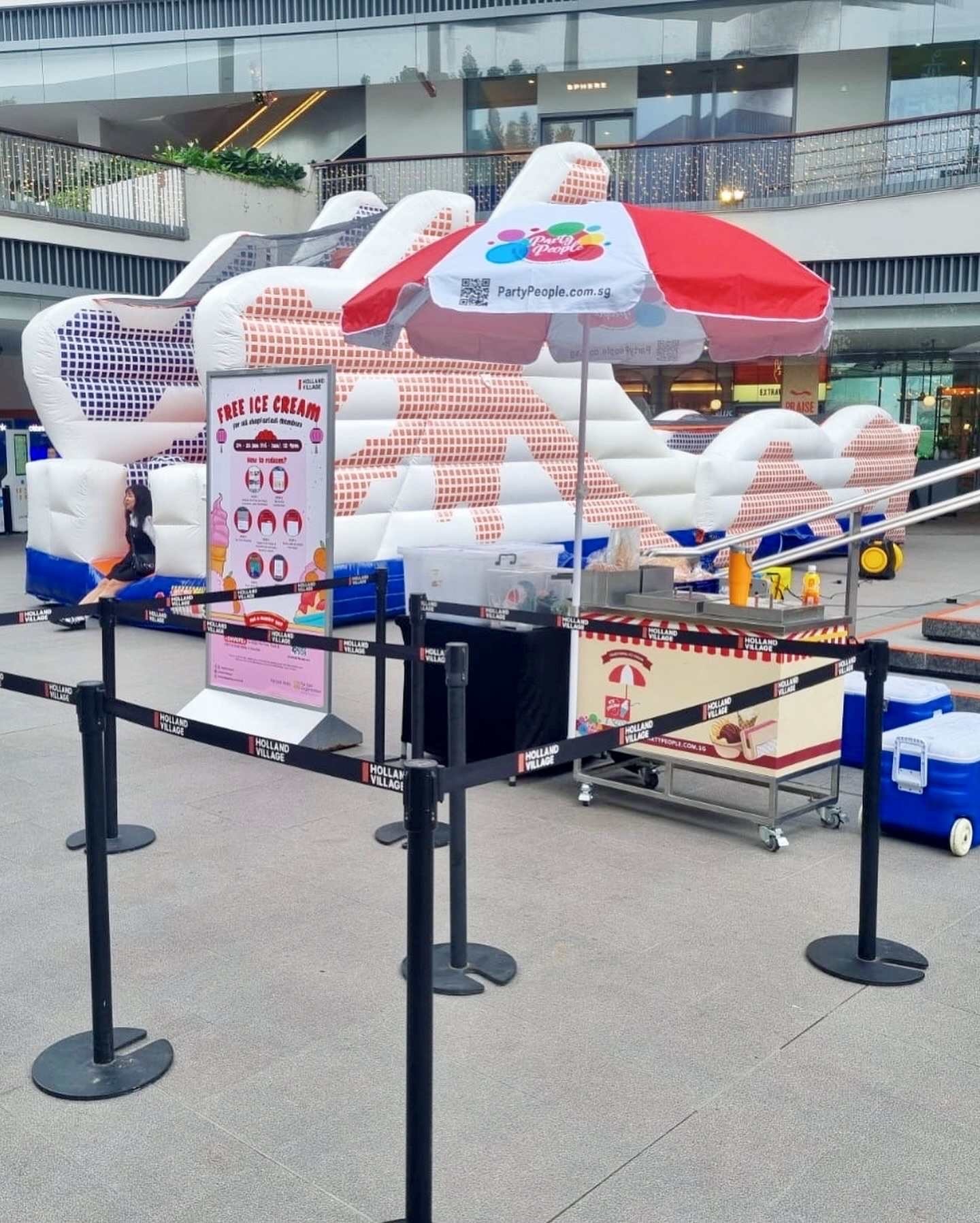 Bouncy castle with ice cream cart theme at a mall event in Singapore