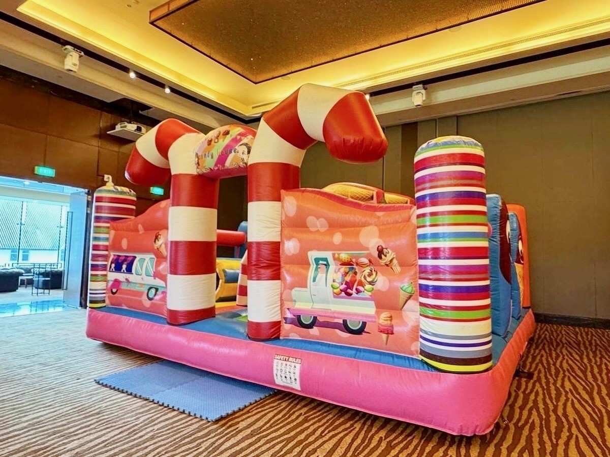 Candy-themed bouncy castle Singapore rental at indoor hotel event