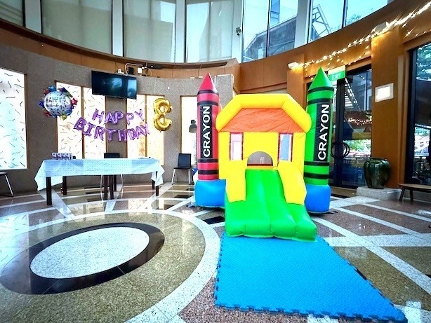 Crayon-themed bouncy castle rental for a kids birthday party in Singapore