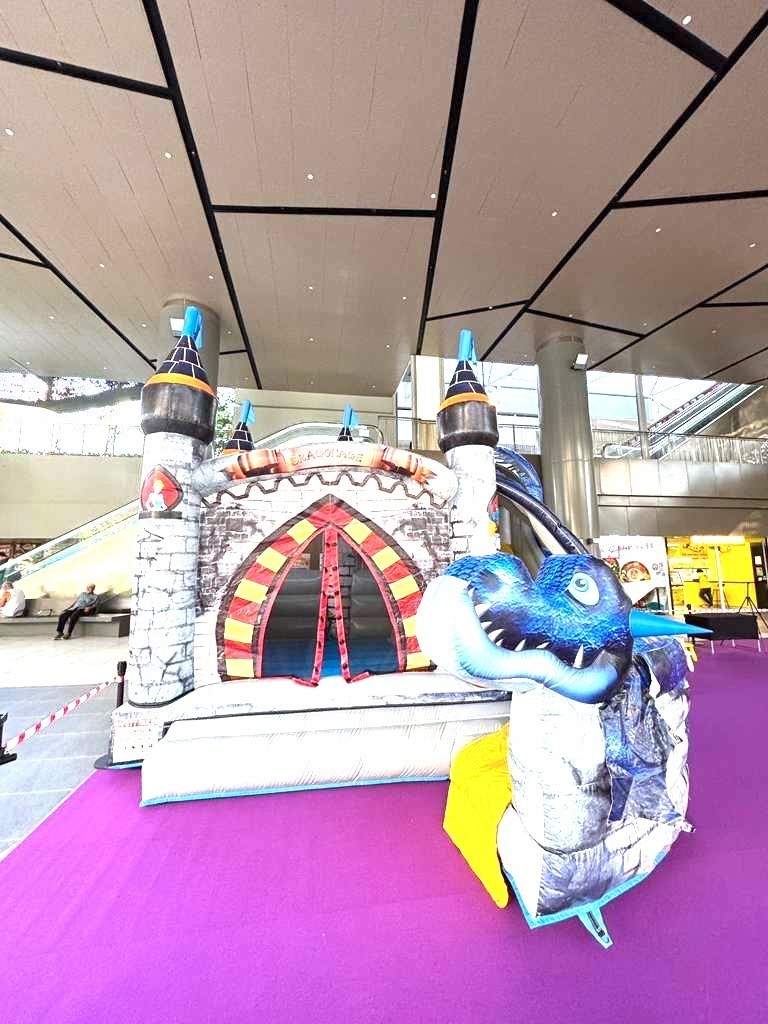 Dragon castle bouncy castle rental at a shopping mall event in Singapore