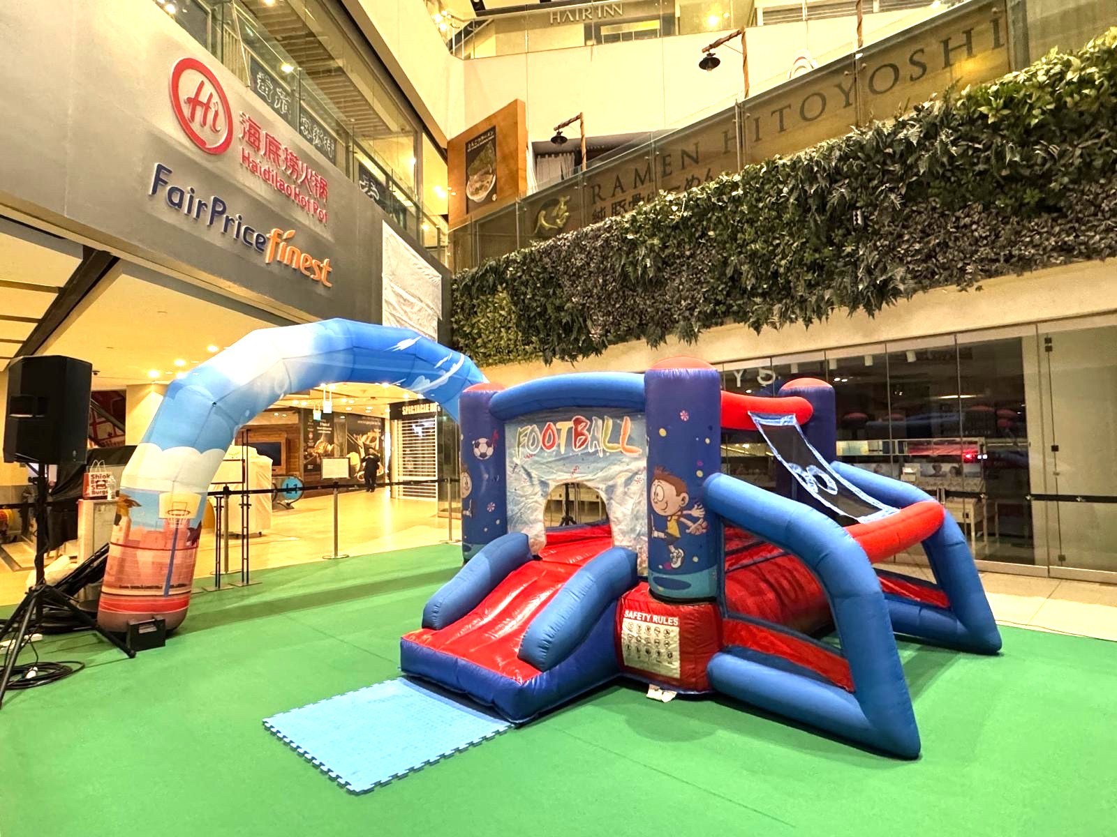 Football-themed bouncy castle rental at a shopping mall event in Singapore