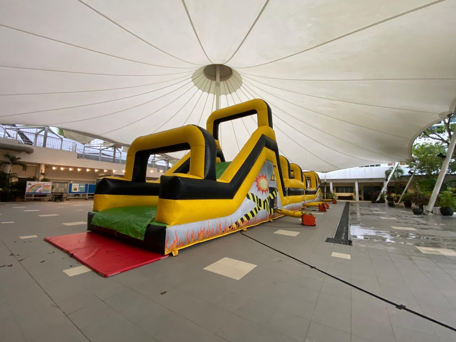 Giant inflatable obstacle course rental for covered venue event in Singapore