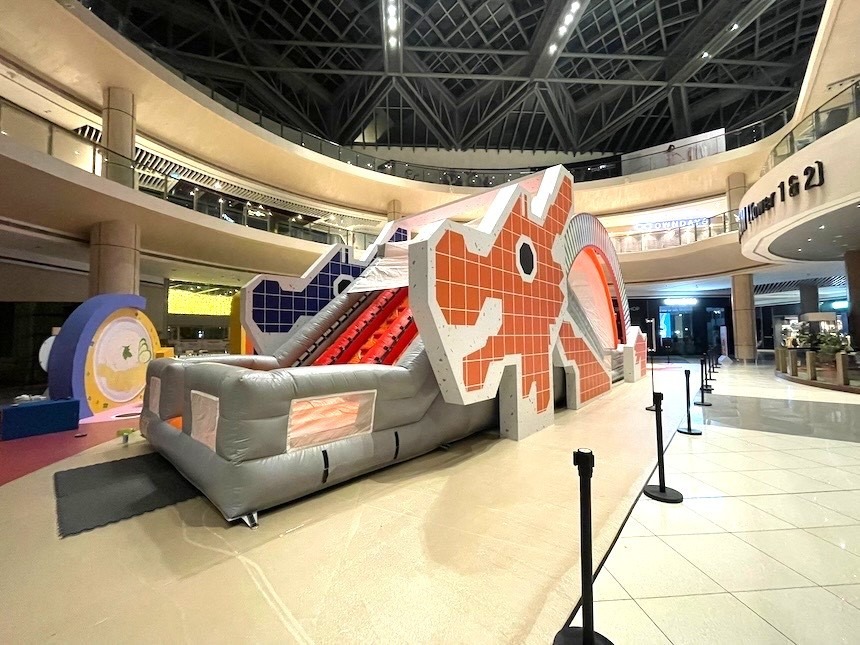 Large inflatable obstacle course set up at a shopping mall event in Singapore