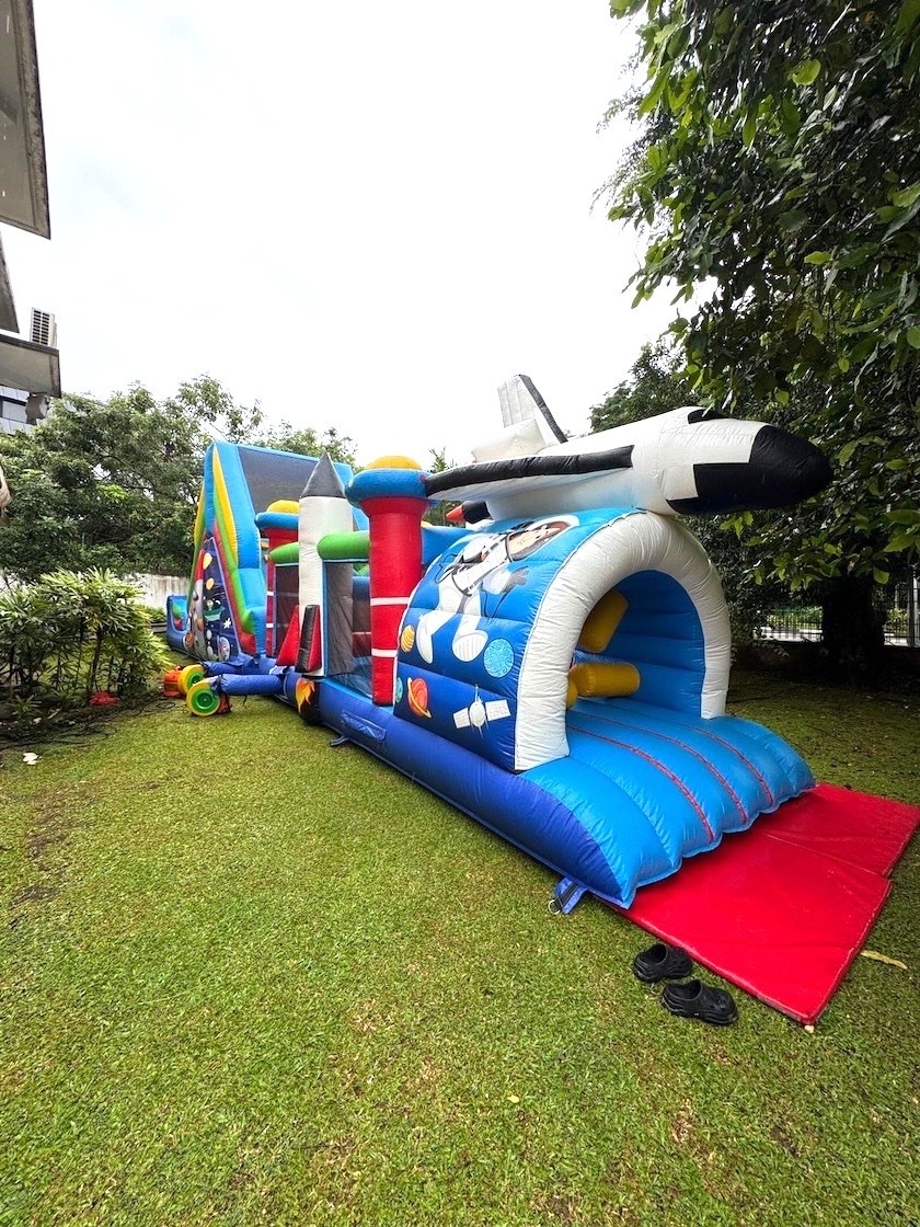 Space shuttle-themed bouncy castle obstacle course rental in Singapore