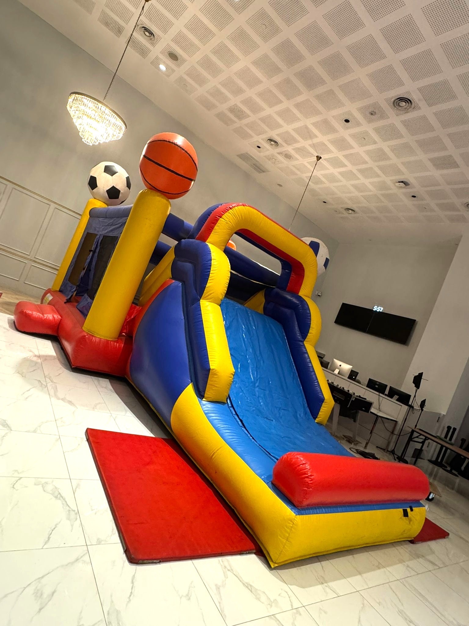 Sports themed bouncy castle and slide rental for indoor event in Singapore