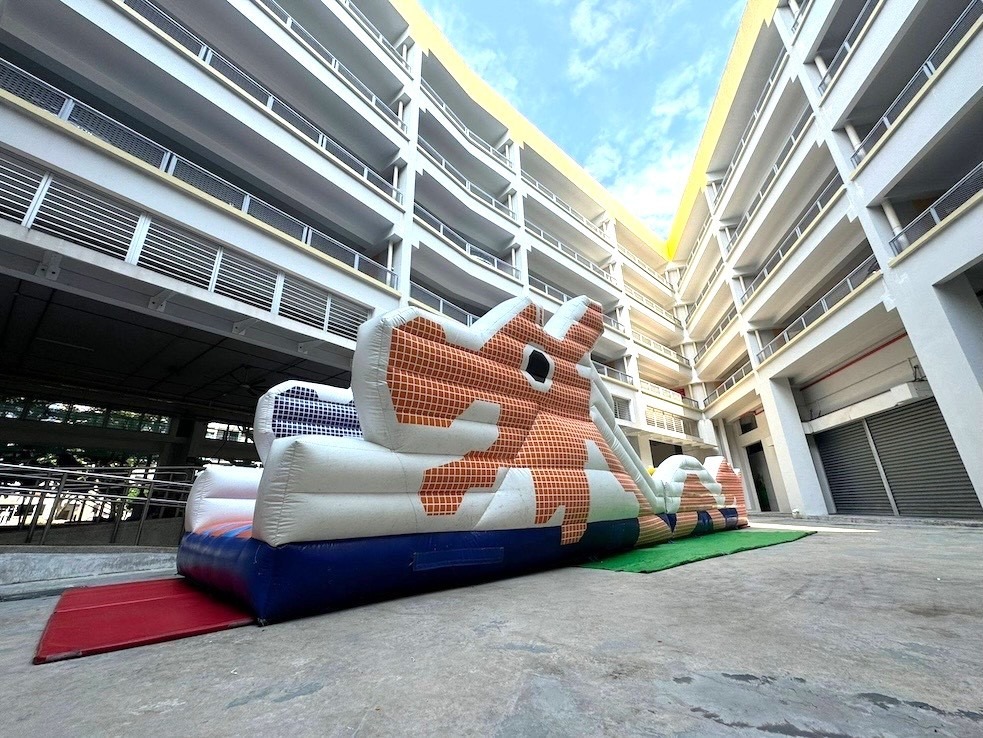 Giant inflatable bull obstacle course rental for community event Singapore