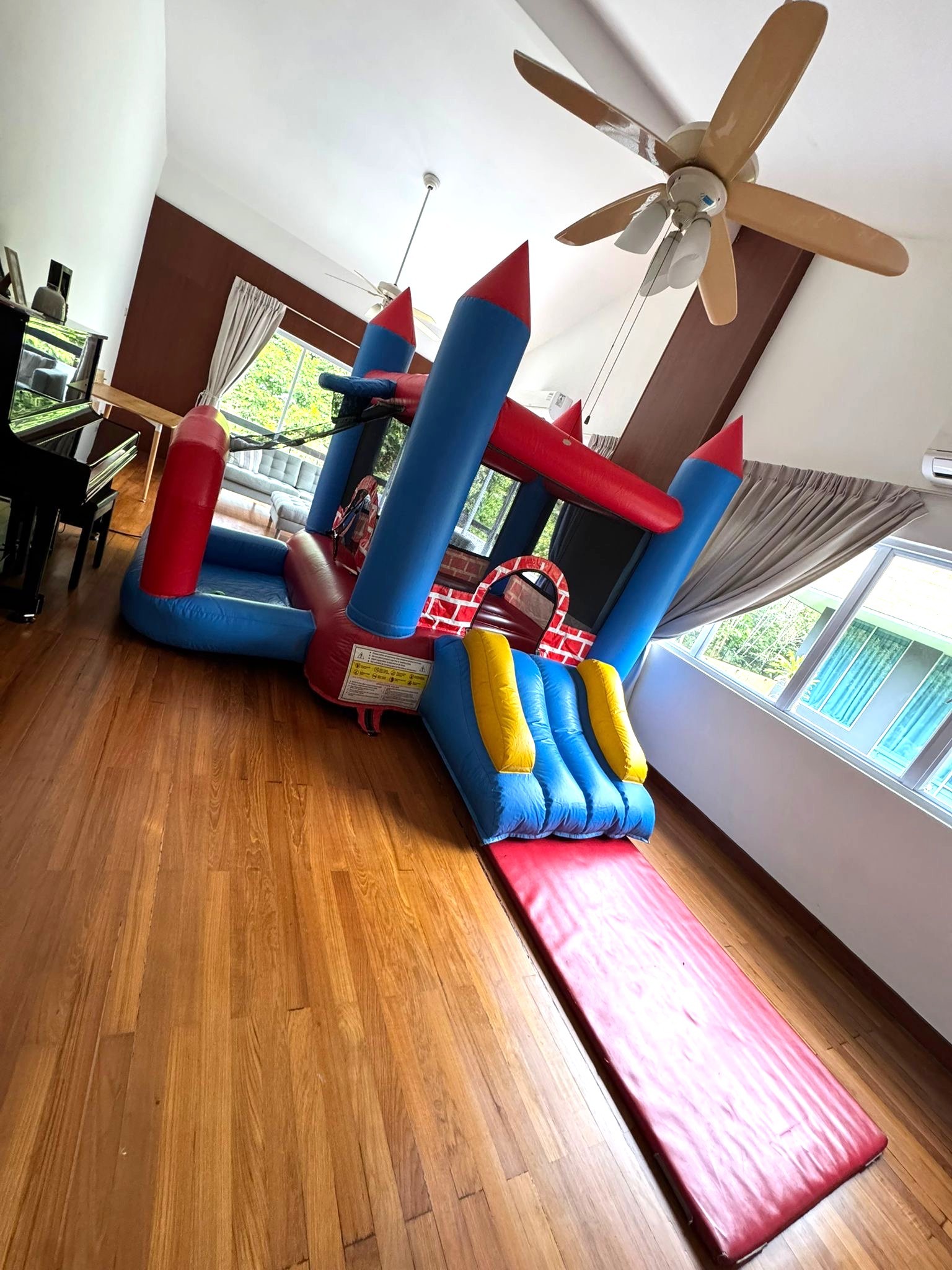 Indoor bouncy castle with slide rental for kids party in Singapore
