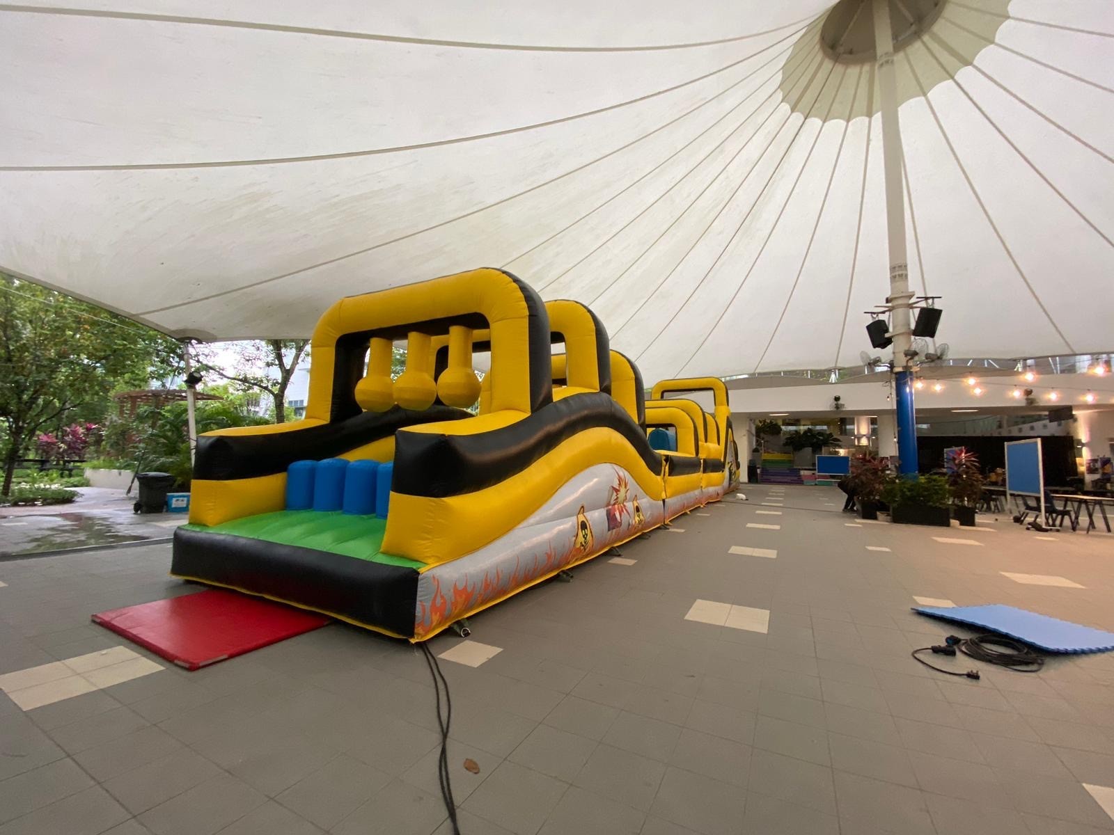 Inflatable obstacle course rental at a covered venue in Singapore