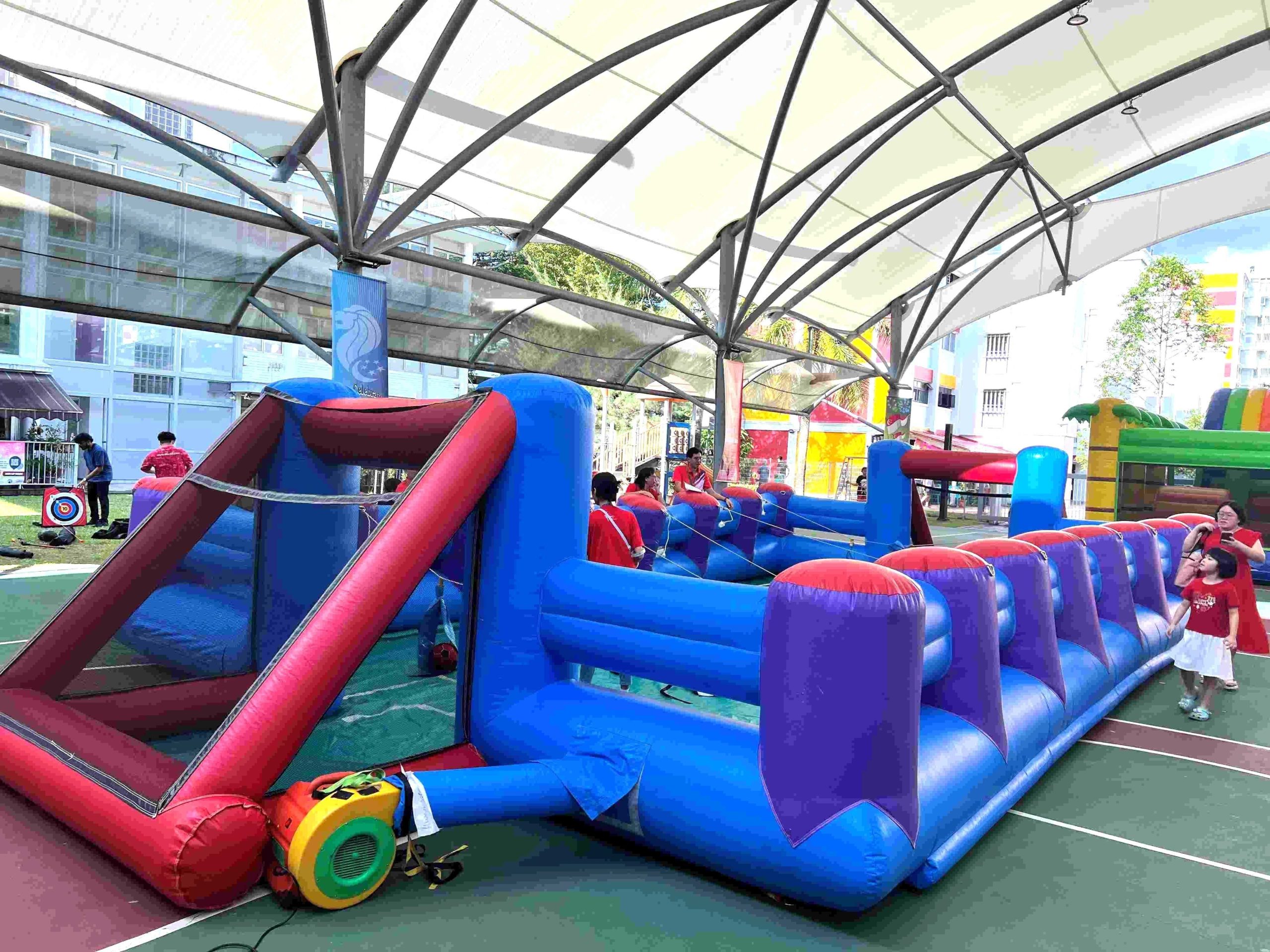 Large inflatable obstacle course rental for school event in Singapore