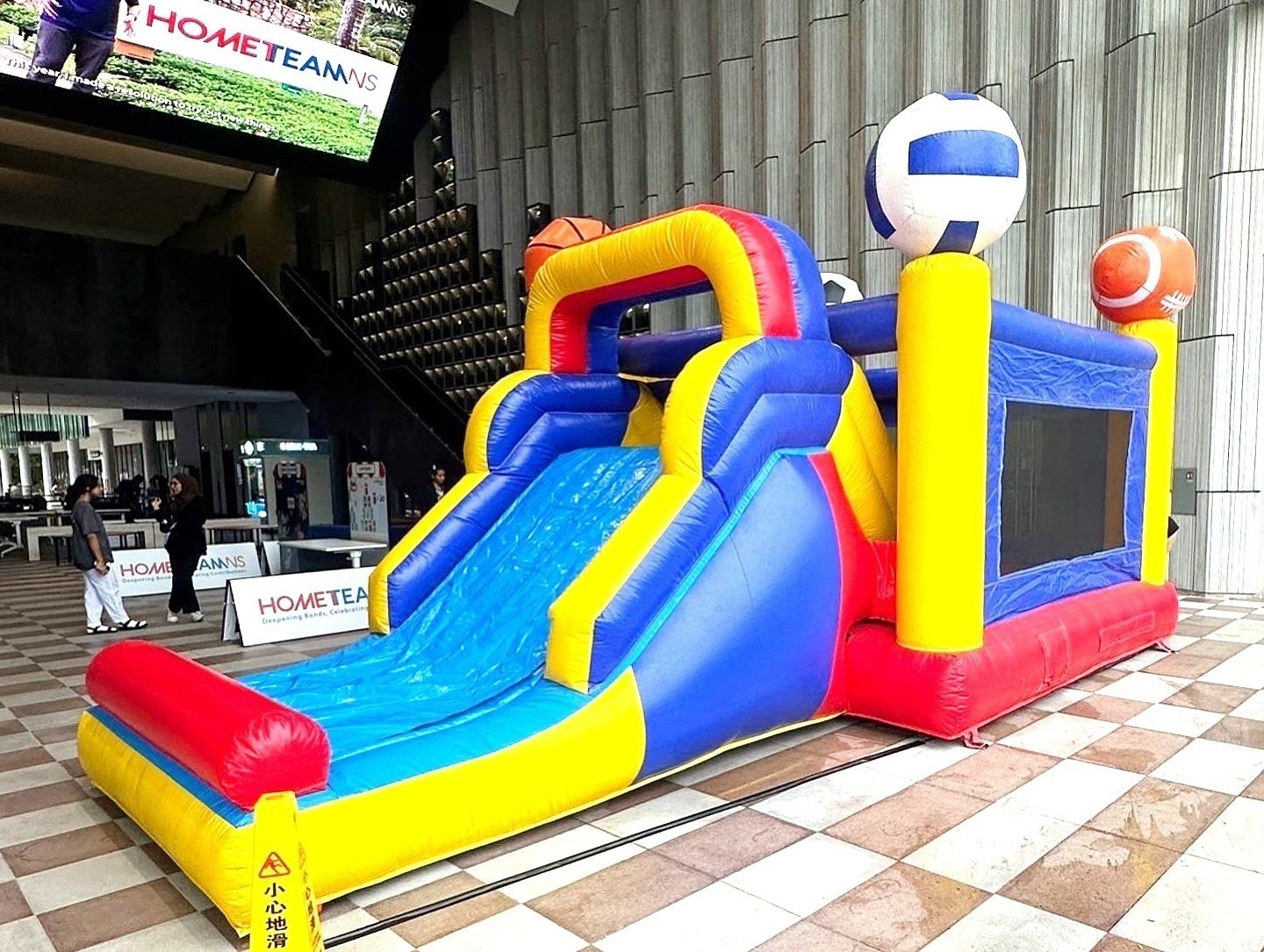 Sports themed bouncy castle slide rental at HometeamNS Singapore