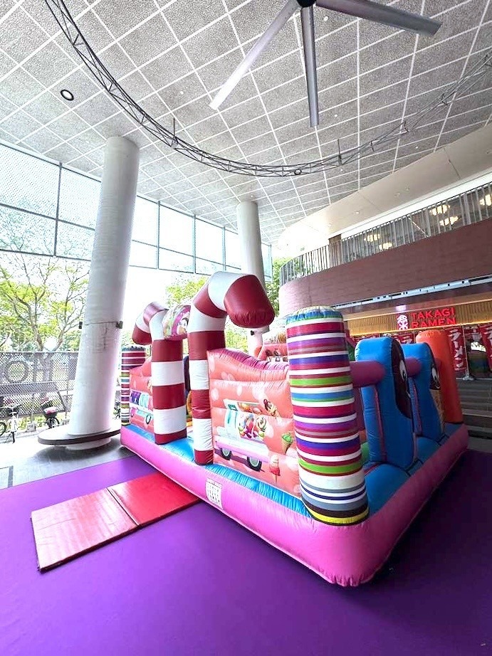 Candy themed bouncy castle inflatable playground rental at a Singapore mall