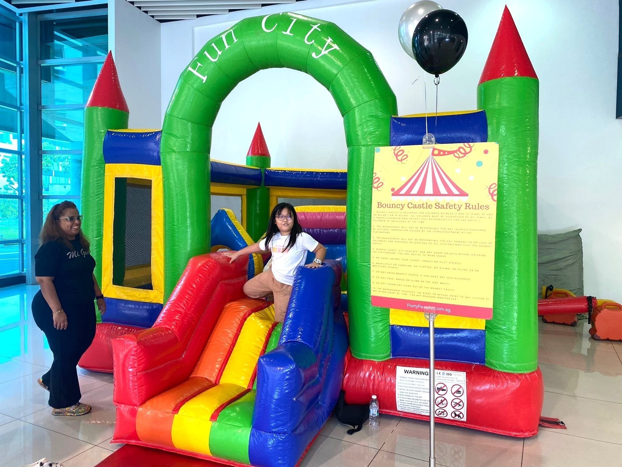 Fun City bouncy castle with slide for kids party rental Singapore