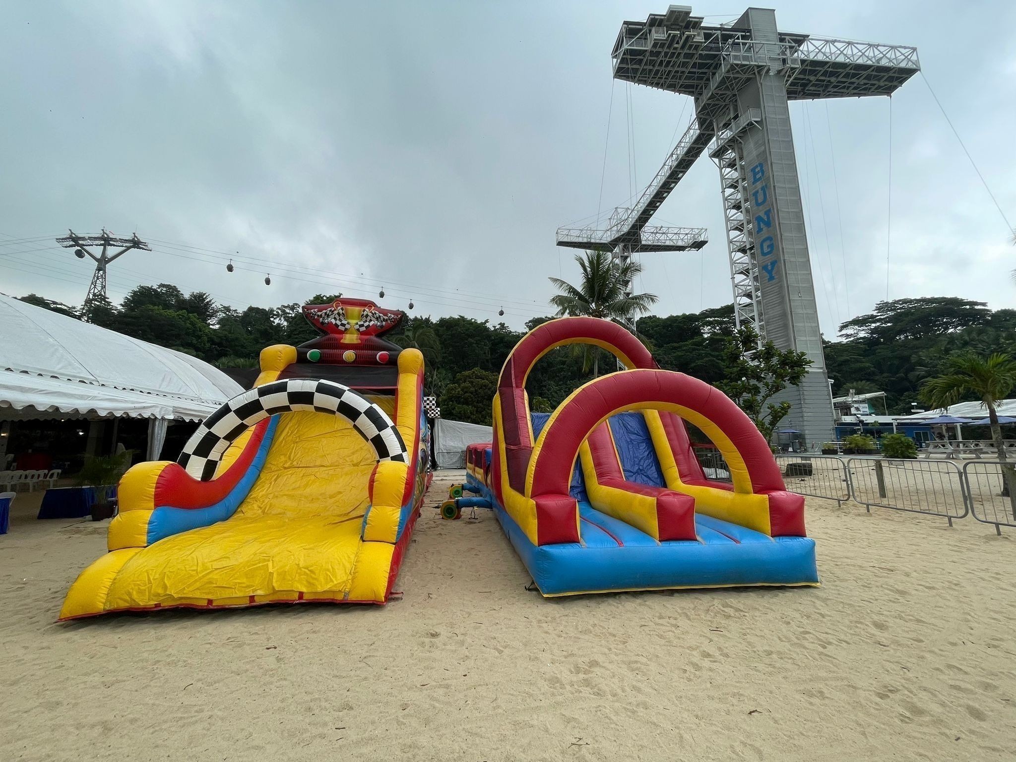 Inflatable obstacle course bouncy castle rental at a beach event in Singapore