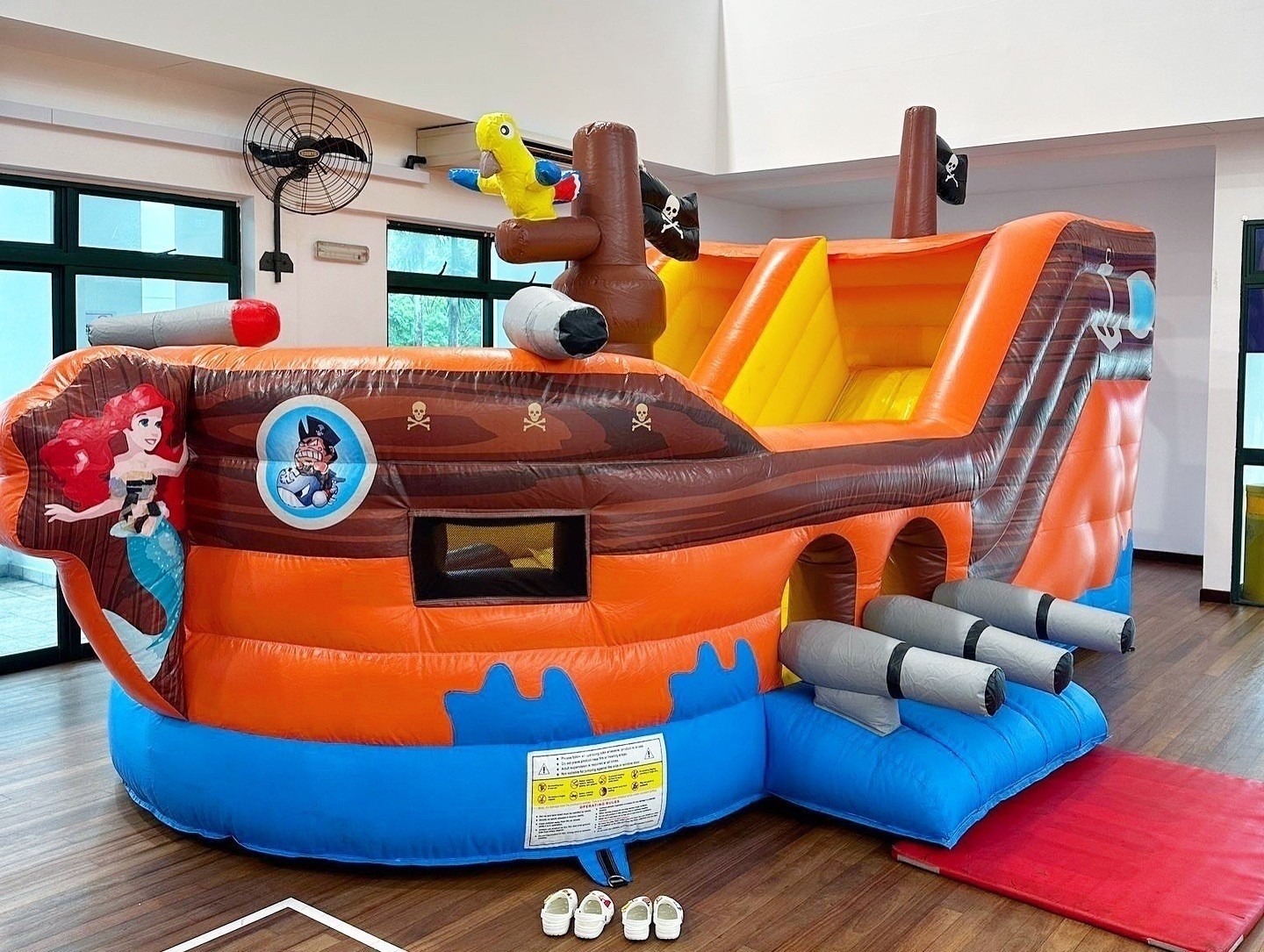 Pirate ship themed bouncy castle slide rental at a kids party in Singapore
