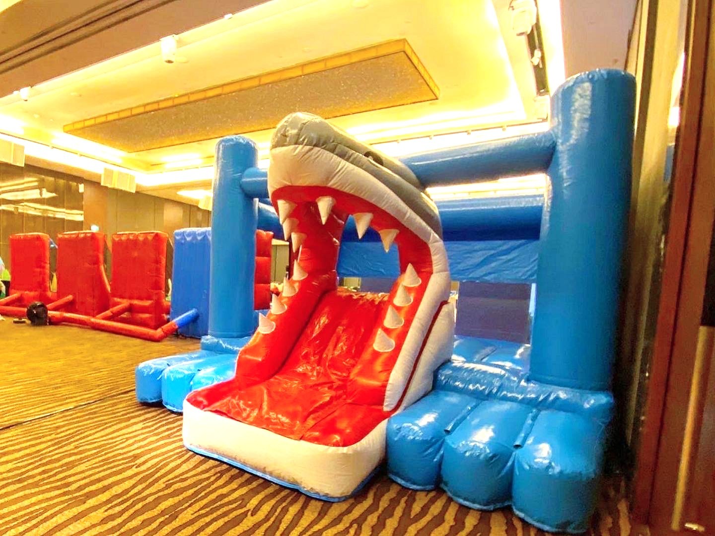 Shark themed bouncy castle slide at an indoor event rental in Singapore