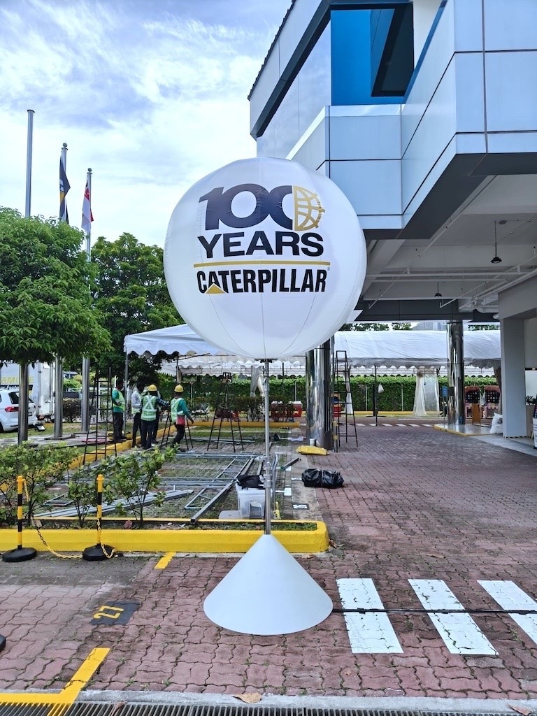 Branded advertising balloon stand at Singapore corporate event