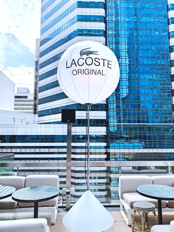 Branded advertising balloon stand at corporate event in Singapore