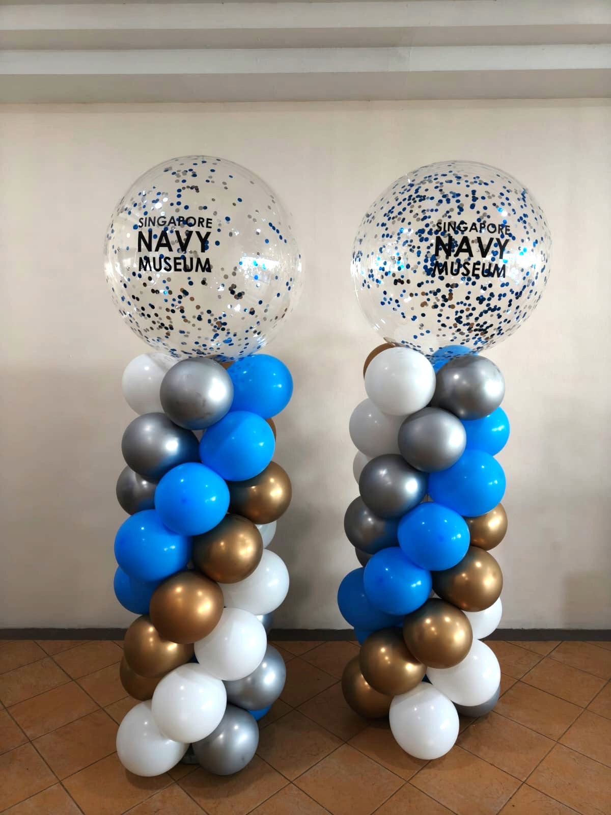 Custom branded balloon columns at a corporate event in Singapore