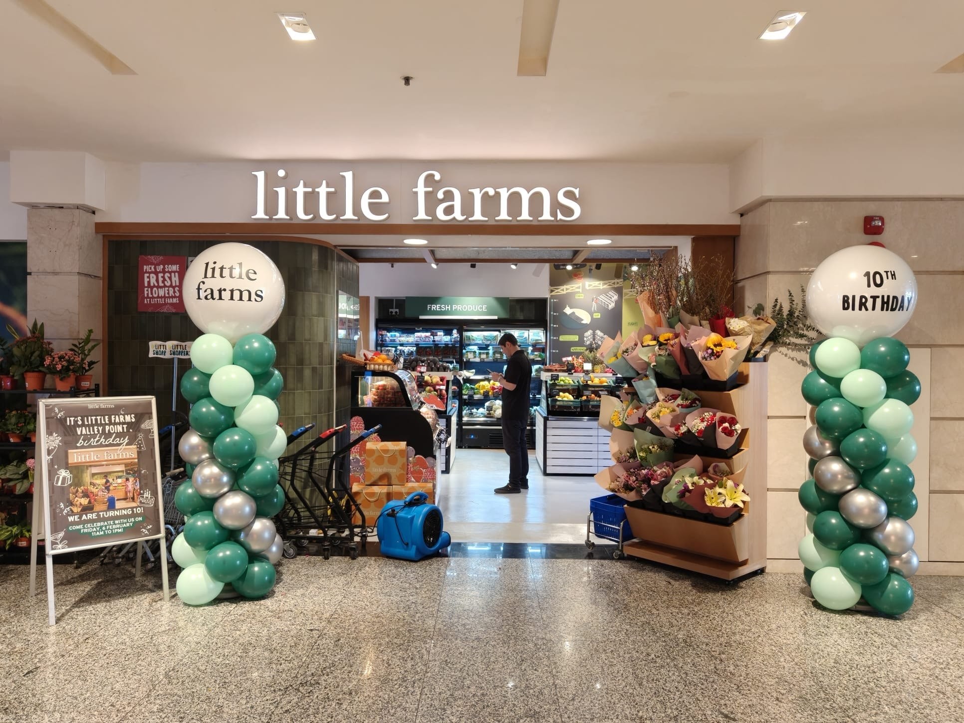 Custom branded balloon columns for a store opening celebration in Singapore