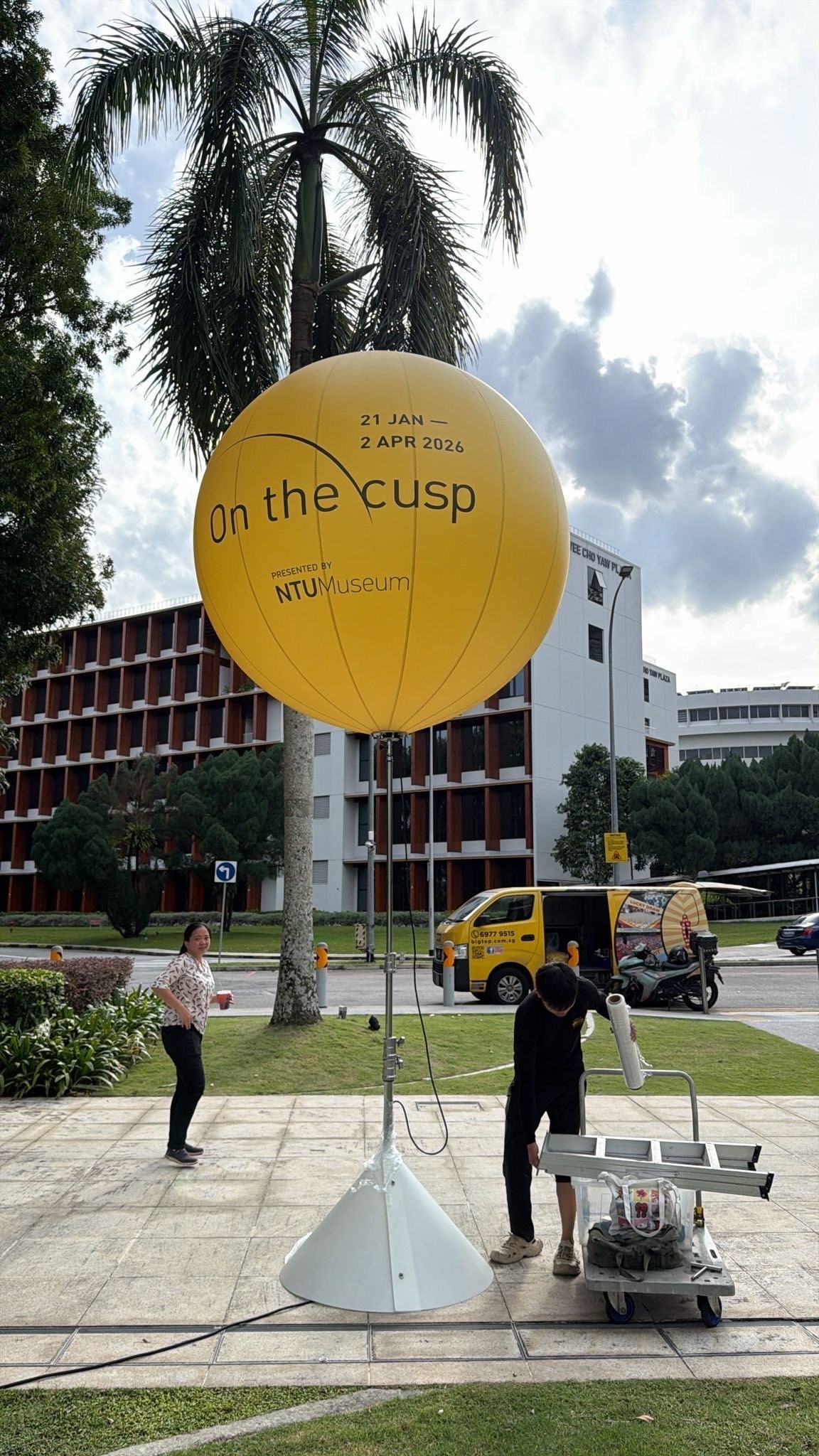 Custom printed advertising balloon stand at NTU campus event in Singapore