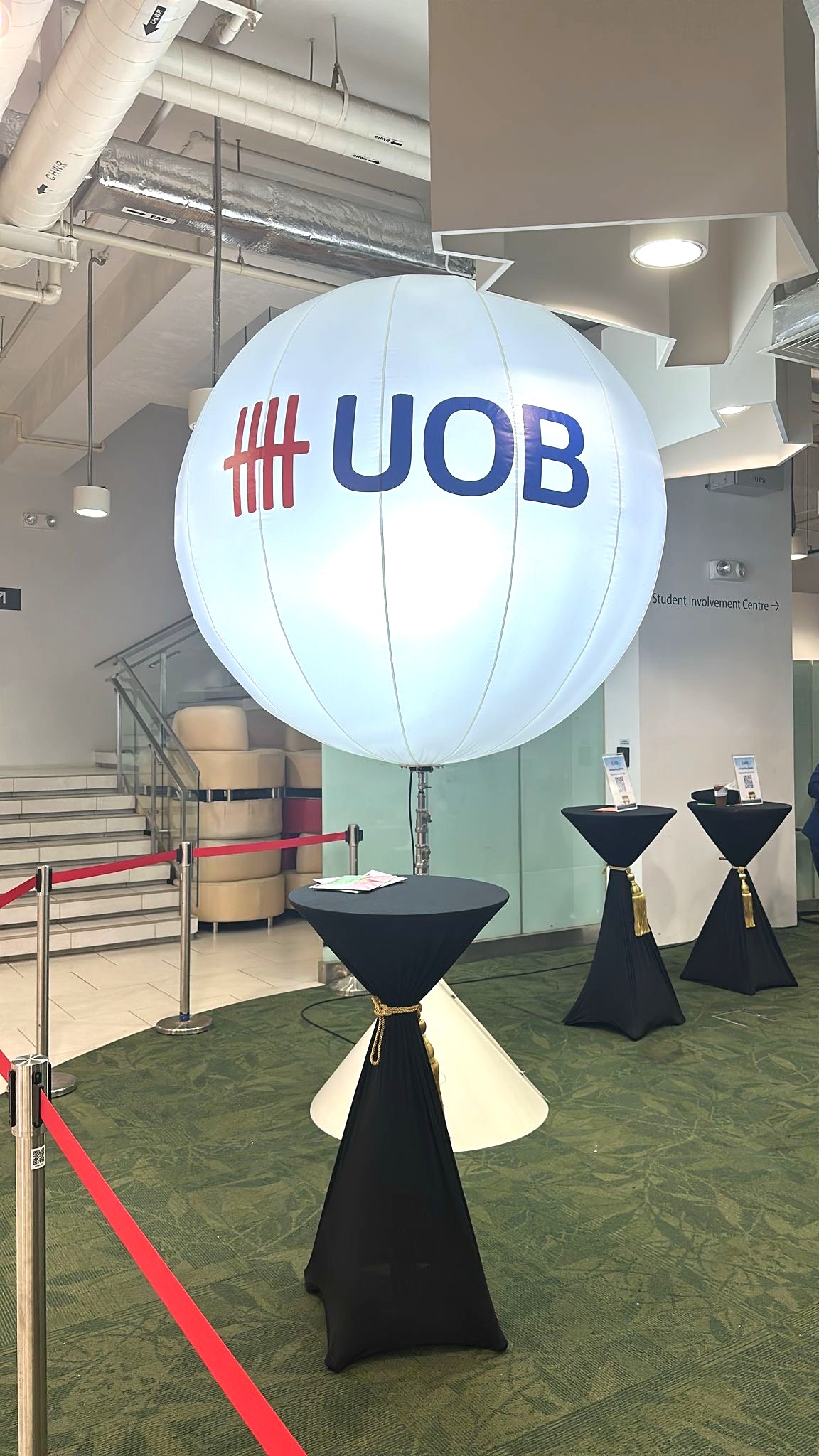 Lighted advertising balloon stand at Singapore corporate event