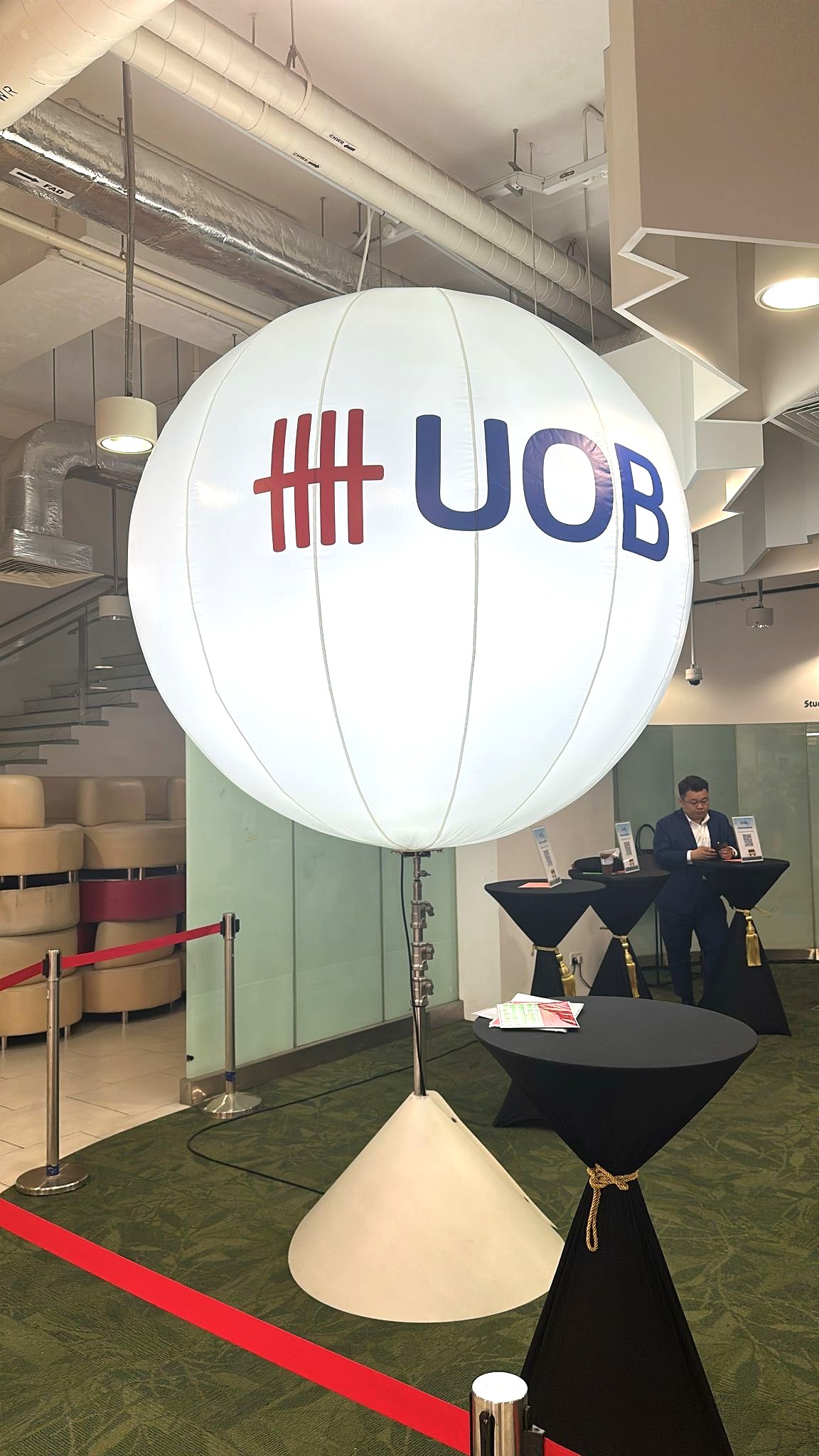 Lighted advertising balloon stand at a corporate event in Singapore