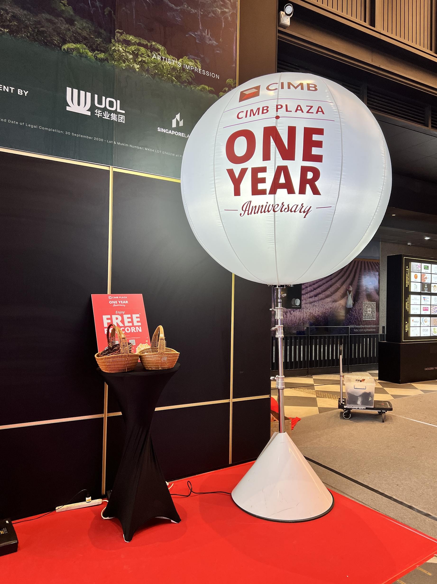 CIMB anniversary balloon stand with a short event message