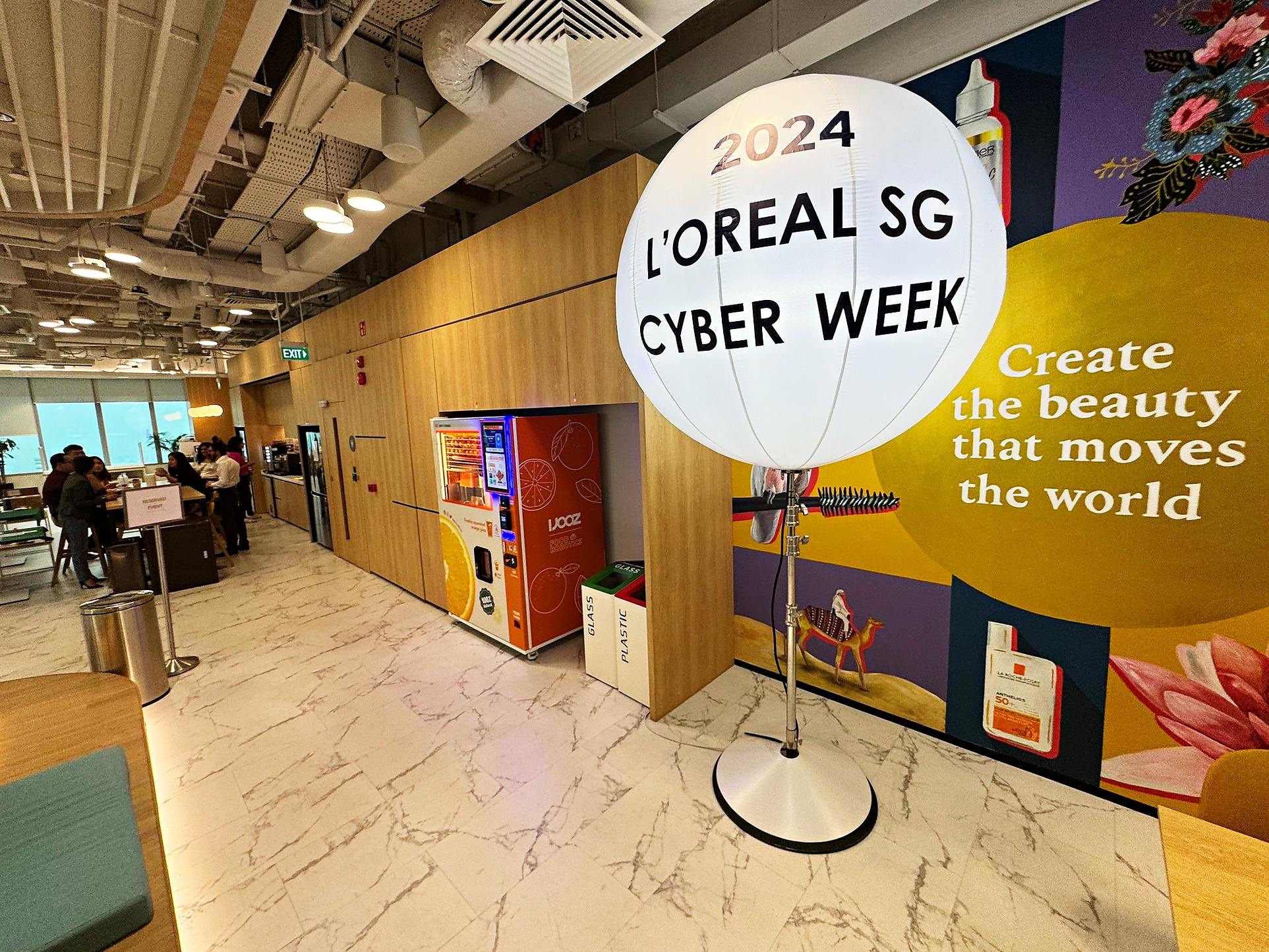 Lighted balloon stand displaying a corporate campaign message