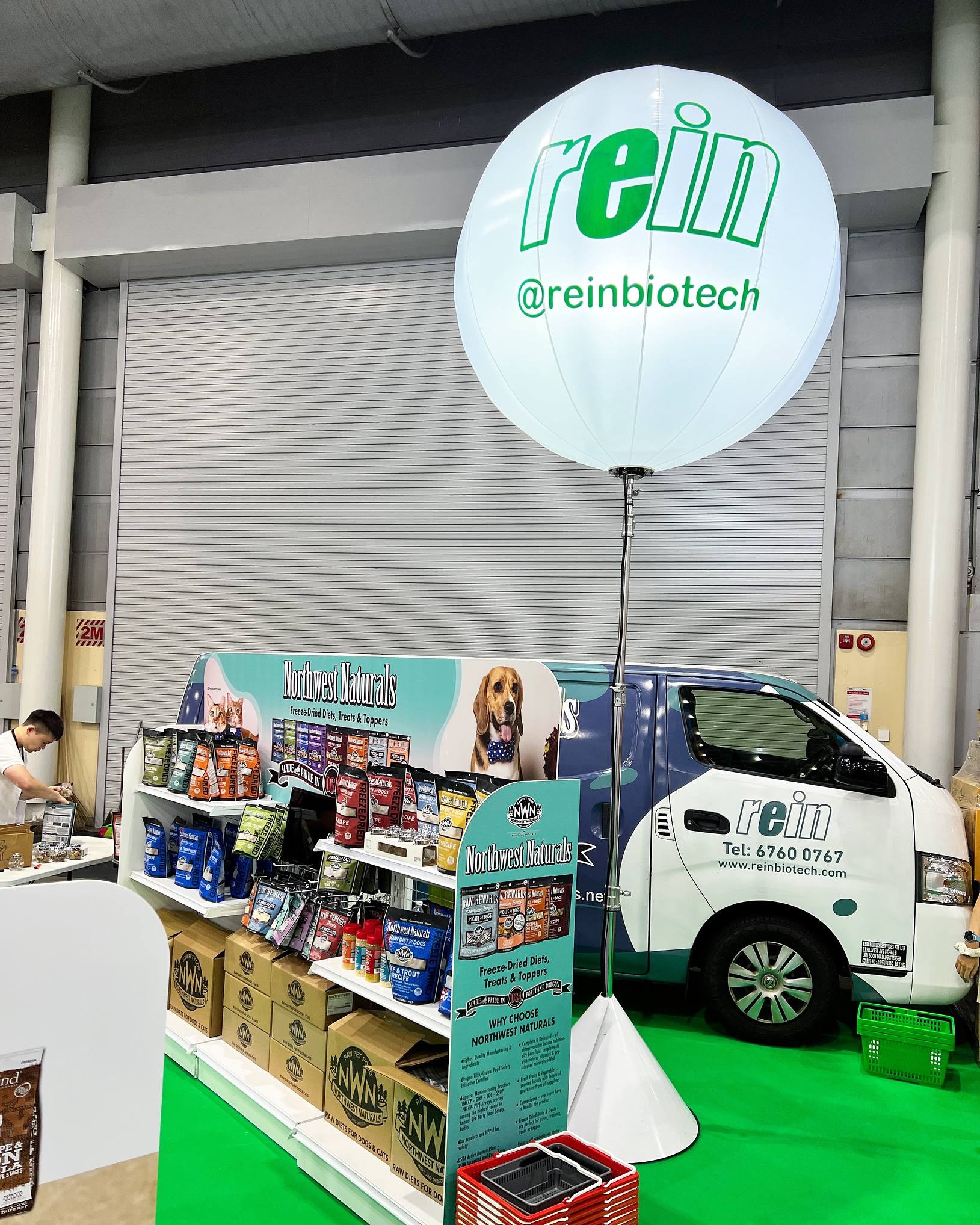 Rein branded balloon stand at a product exhibition