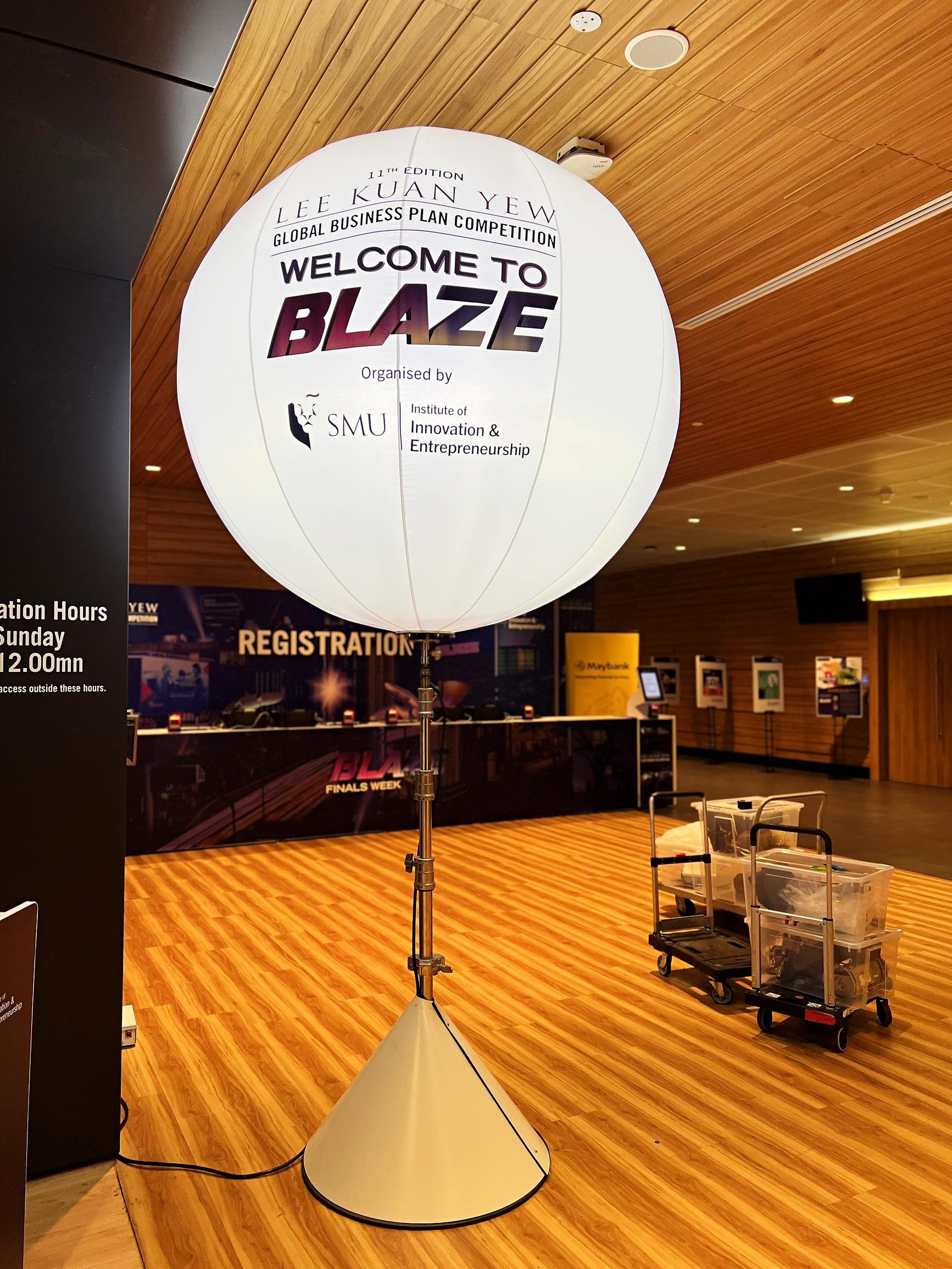 Lighted balloon stand with a welcome message near registration