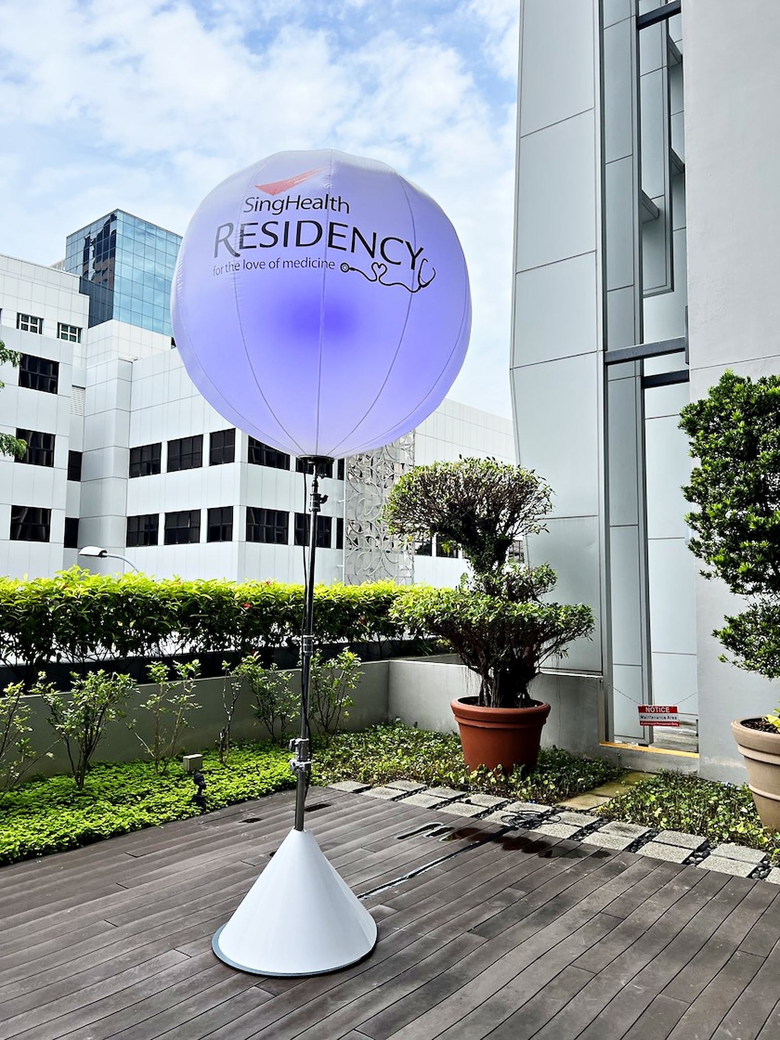 SingHealth Residency balloon stand on an outdoor terrace