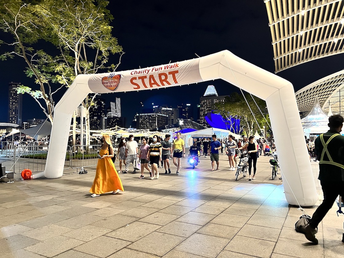 White START arch at an evening charity run