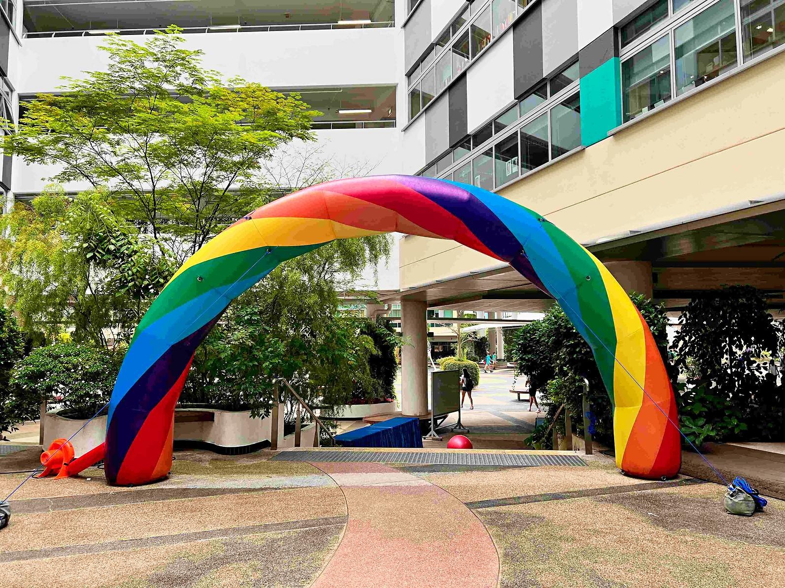 Landscape view of a rainbow arch spanning an open courtyard